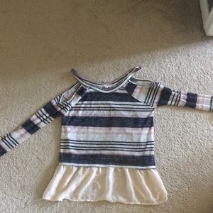 A open shoulder long sleeve top